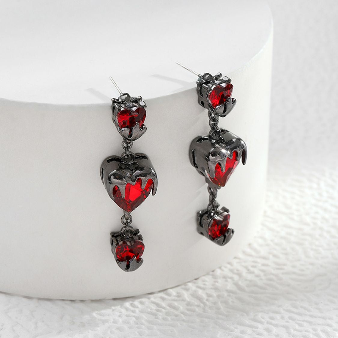 “Bleeding Love” Heart Earrings