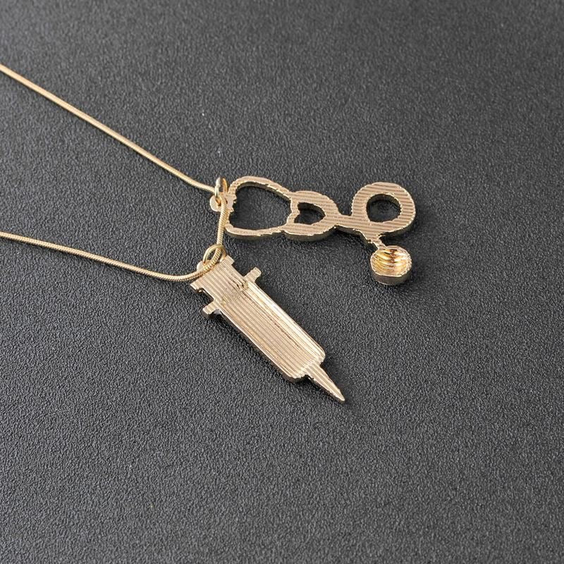 “Health Bae” gold plated Stethoscope syringe Necklace