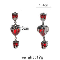 “Bleeding Love” Heart Earrings