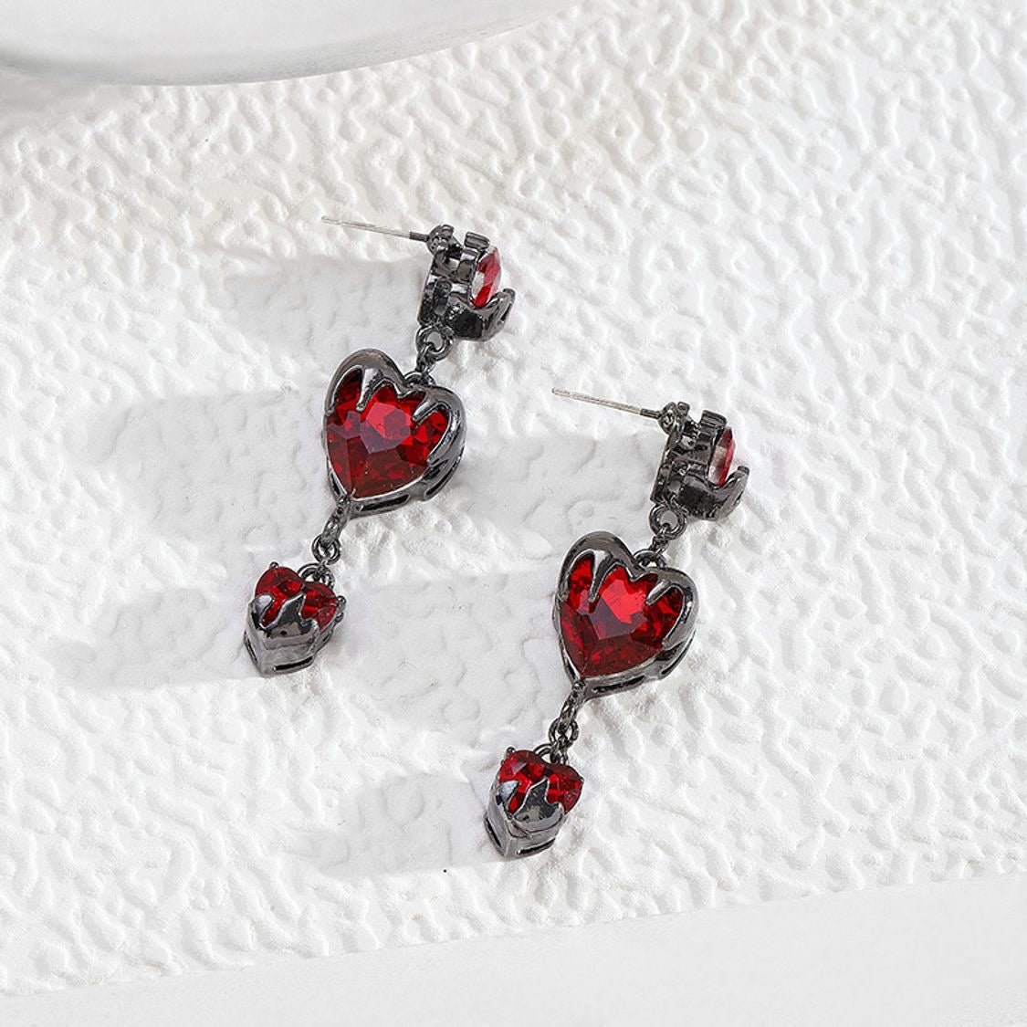 “Bleeding Love” Heart Earrings